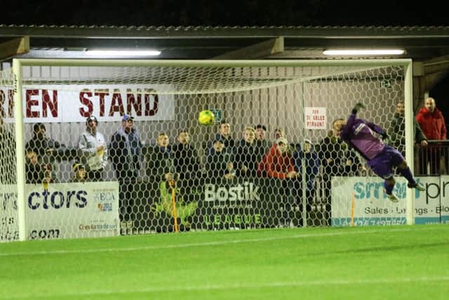 Cray goalkeeper Nick Blue is beaten as Hastings United take the lead. Picture courtesy Scott White