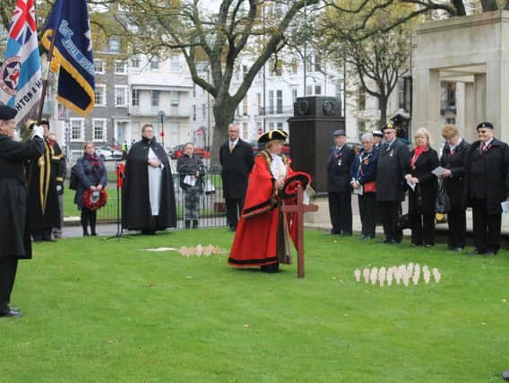 The former Mayor of Brighton and Hove laying a wreath at the Old Steine memorial garden in 2015