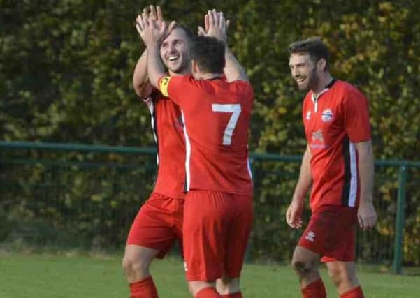 Crawley Down Gatwick's Michael Belli celebrating goal number five against Eastbourne Utd with Dan Sullivan. Picture by Tony Brown SUS-171024-123445002