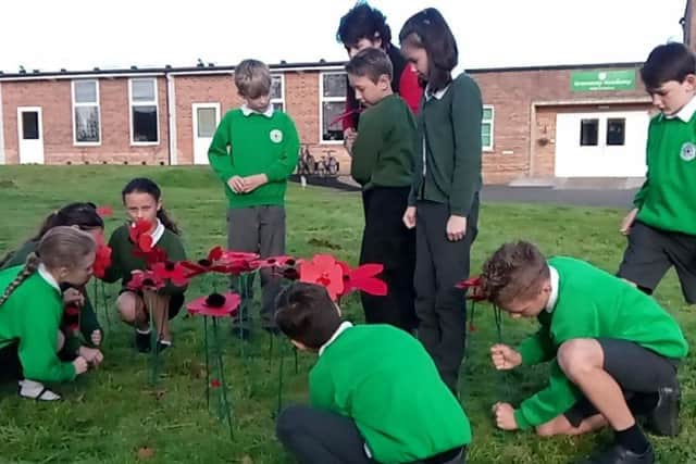 Planting poppies at Greenway Academy