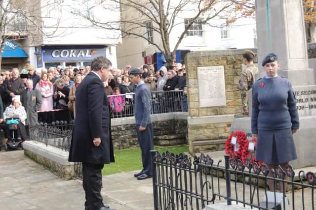 Horsham MP Jeremy Quin lays his wreath