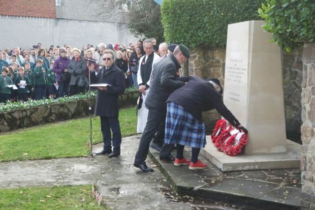 Ex-Royal Marine Wren Barbara Stubbings assisted by Ex-Royal Green Jacket Rifleman Stuart Williams lays a wreath commemorating the centenary of the founding of the WRNS, at Rustington War Memorial on Remembrance Sunday. There were 100 of these wreaths laid worldwide, and it is an honour that this one was placed here.