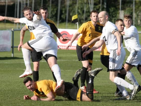 Golds defender Ross McKay played the full 90 minutes in his side's heavy defeat at Loxwood on Saturday. Picture by Derek Martin DM17314399