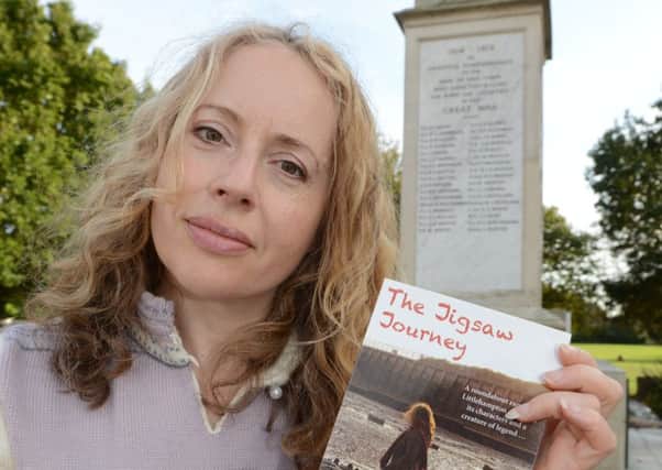 Allis Moss with her book, The Jigsaw Journey