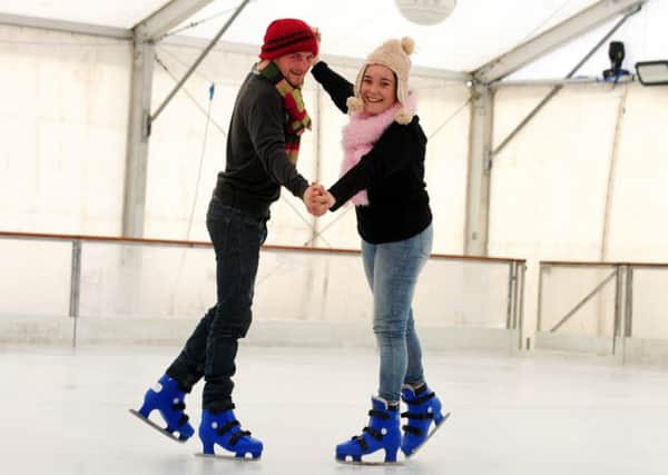 James Merrett and Chloe Gilmour try out their skill on the ice. Picture by Kate Shemilt ks171472-8