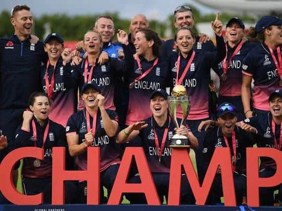 England women's team celebrate winning the World Cup.