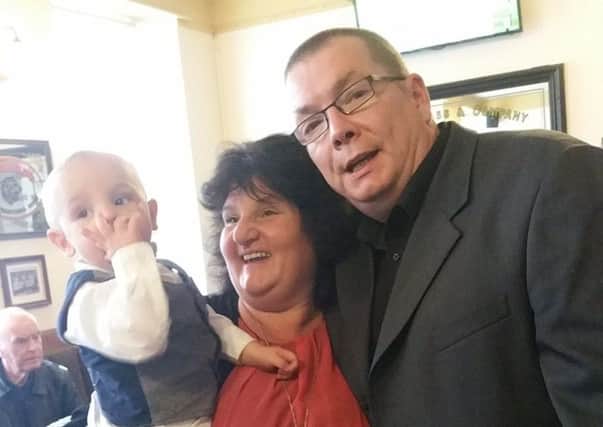 Michael Long was a 'most loving granddad', pictured with wife Helen and grandson Michael Ayres