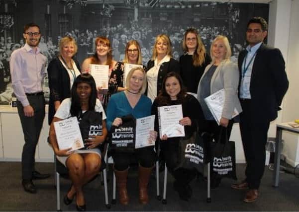 Eight Affinity Sutton residents in Haywards Heath have graduated from the first course. Picture supplied by Clarion Futures