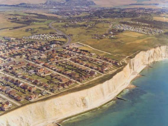 An aerial view of the eastern side of Peacehaven showing the dramatic white chalk cliffs. The town was laid out on a grid system that many visitors feel gives it the ambience of a typical USA suburb.