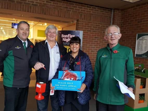 Nus Ghani, MP, collecting with Cllr Bob Standley and two members of staff from Morrisions supermarket