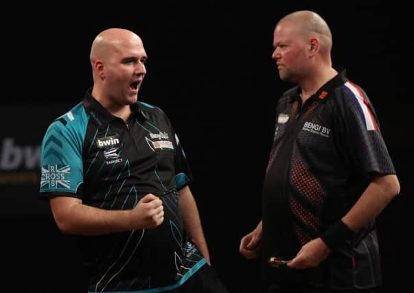 Rob Cross celebrates during his victory over Raymond van Barneveld. Picture courtesy Lawrence Lustig