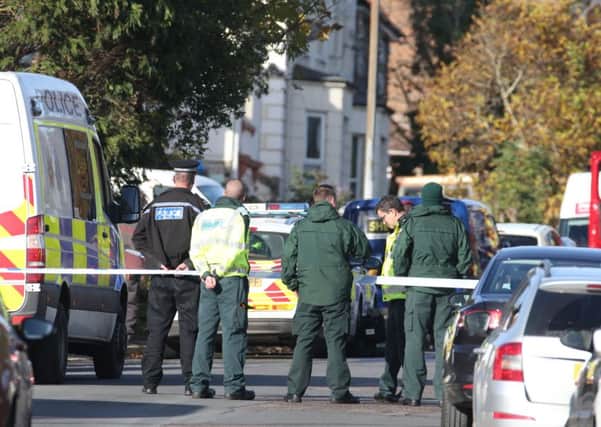 Police are involved in a stand-off with a man armed with a knife in Battle Road.
