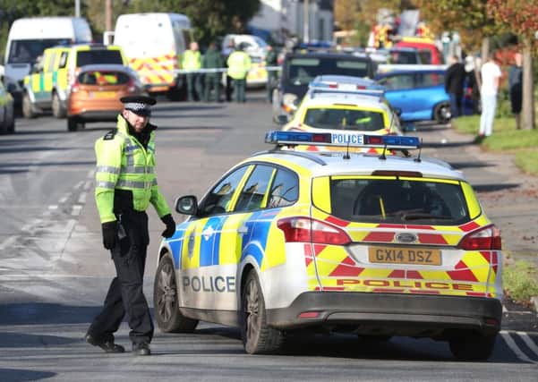 Police are involved in a stand-off with a man armed with a knife in Battle Road.