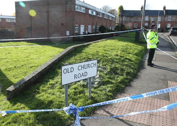 Police have taped off Old Church Road as they investigate a stabbing.