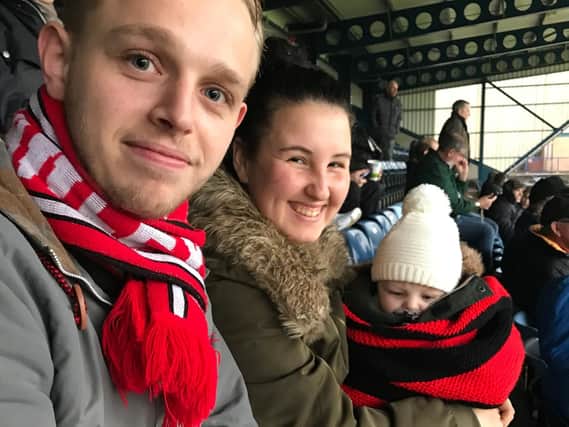 Four-month-old Louie Pidgeon who attended his first Reds game at Wycombe on Saturday with proud parents, Reds fans Miles and Emma