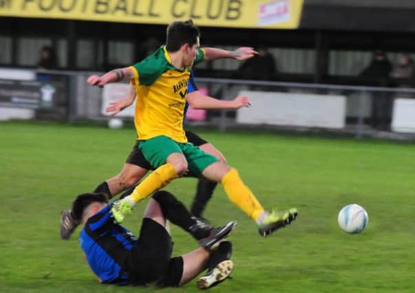 Liam Bush battles for the ball for Sidlesham against Worthing / Picture by Kate Shemilt