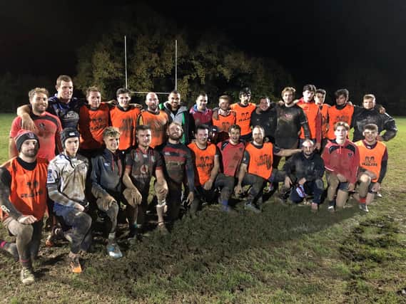 Quins professionals Joe Marchant and Dave Ward surrounded by the Heath senior squad after a productive session last Thursday