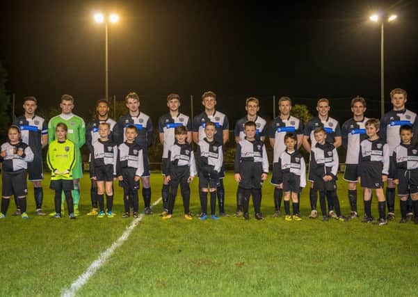 The East Preston FC under-nines ran out with the first team for the first time in the clubs history