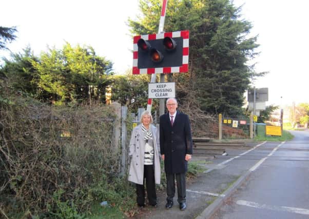 Marilyn Phipps with Nick Gibb at the Toddington Lane level crossing