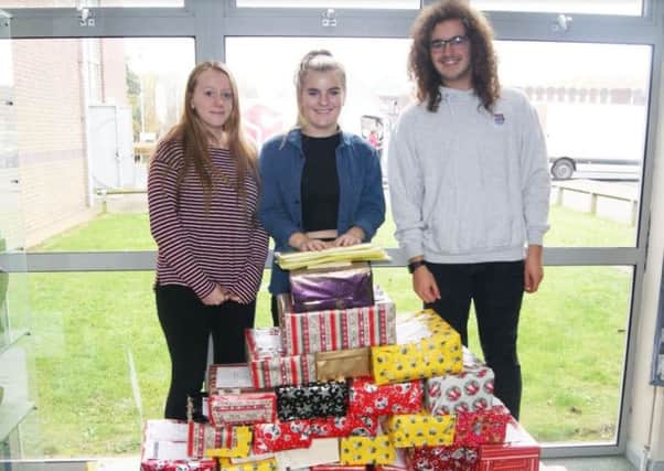 Students with the shoeboxes