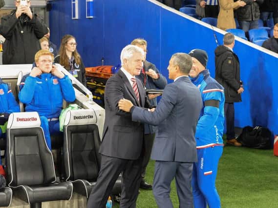 Chris Hughton and Mark Hughes shake hands pre-match at the Amex. Picture by PW Sporting Pics