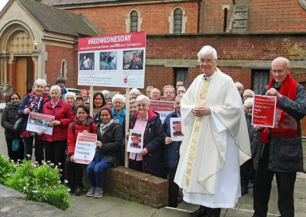 Father John Nuttall with members of the congregation outside St Mary of the Angels Church. Picture: Derek Martin DM17113305a