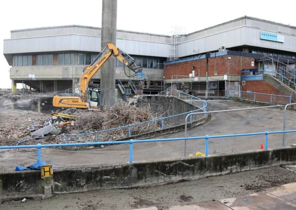 The demolition of the former swimming pool in progress