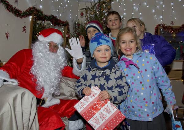 Father Christmas meets children at last years Midhurst Christmas street party PICTURE BY CLIVE BENNETT