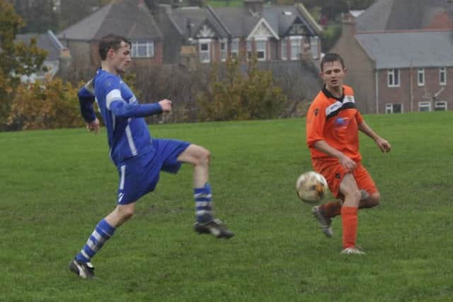 The JC Tackleway II and Sedlescombe Rangers II battle it out at a wet Barley Lane.